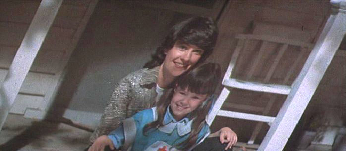 Figure 9: The photo of a girl with her mother—whom Rachael (Sean Young) was programmed to believe was herself. In Deckard’s hand the snapshot appears to come to life for a moment.